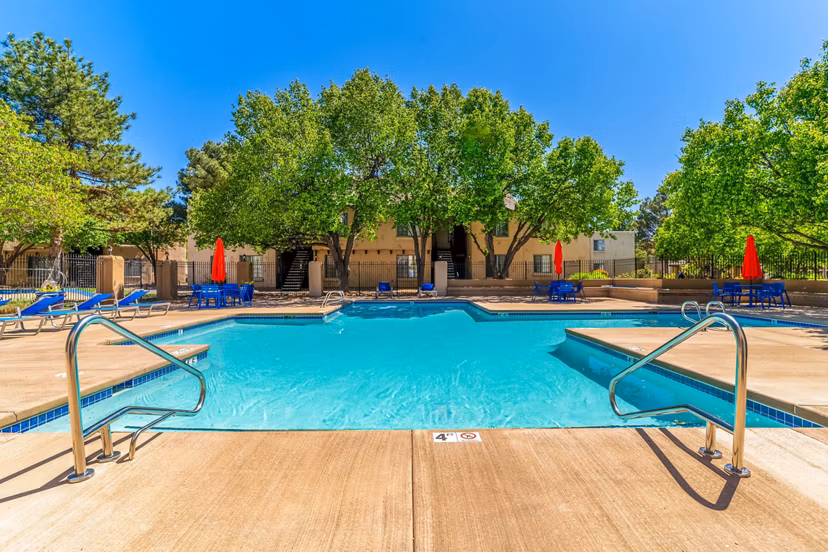 Pool with seating area at Union 505 Apartments in Albuquerque, offering luxurious amenity space for relaxation and leisure