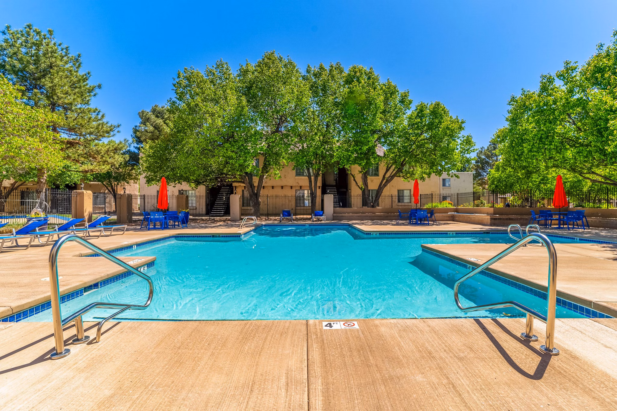 Pool with seating area at Union 505 Apartments in Albuquerque, offering luxurious amenity space for relaxation and leisure