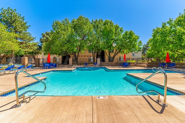 Pool with seating area at Union 505 Apartments in Albuquerque, offering luxurious amenity space for relaxation and leisure