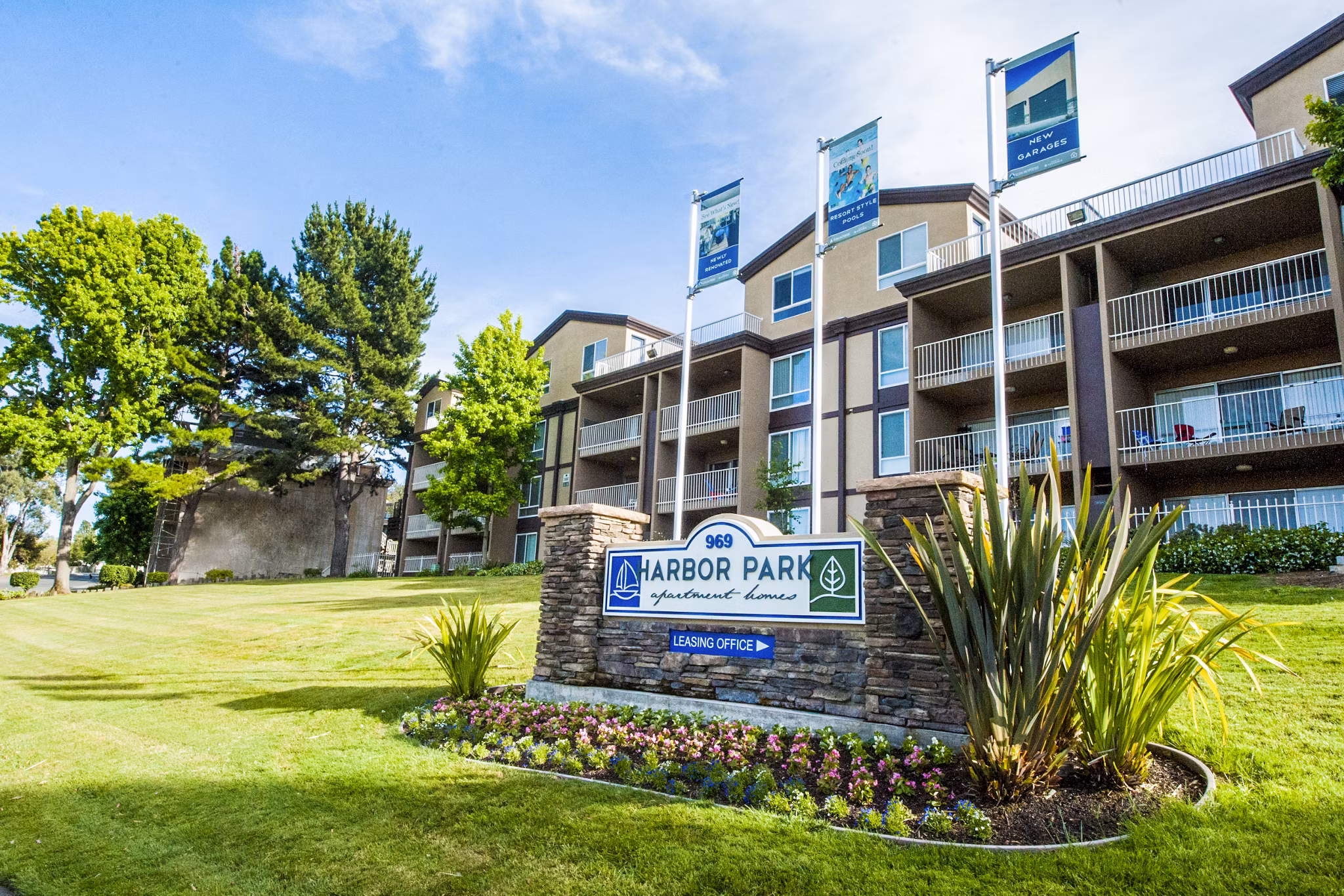 Harbor Park Apartments: Waterfront luxury apartments with modern facade in urban setting