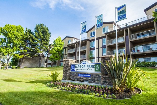 Harbor Park Apartments: Waterfront luxury apartments with modern facade in urban setting