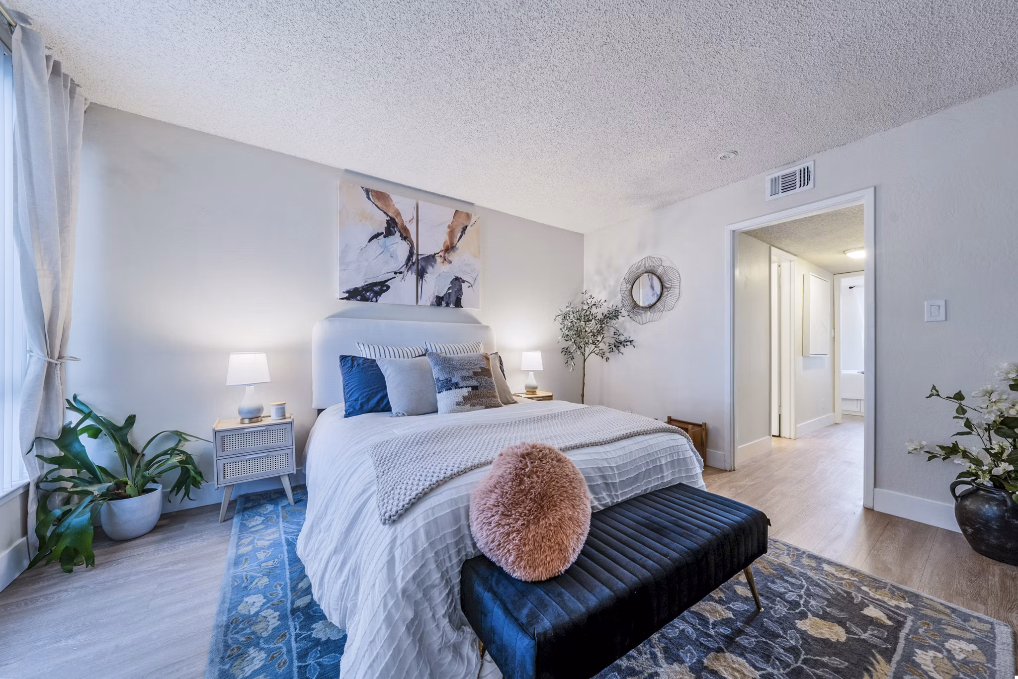 Spacious bedroom with modern decor at Harbor Park Apartments, luxury living by Greystar