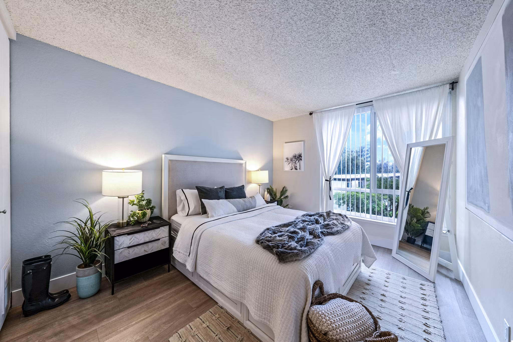 Cozy bedroom with stylish decor at Harbor Park Apartments