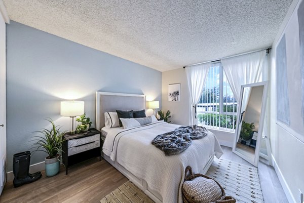 Cozy bedroom with stylish decor at Harbor Park Apartments