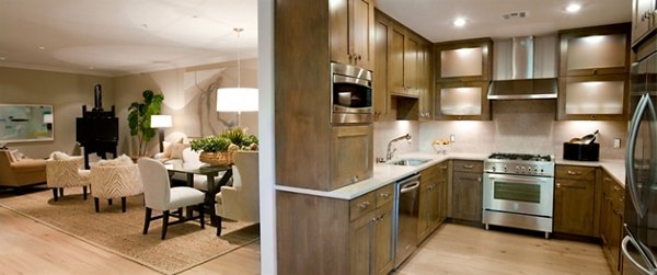 Clubhouse featuring modern lounge seating and a fireplace at 885 Woodside Apartments, offering luxury amenities for residents