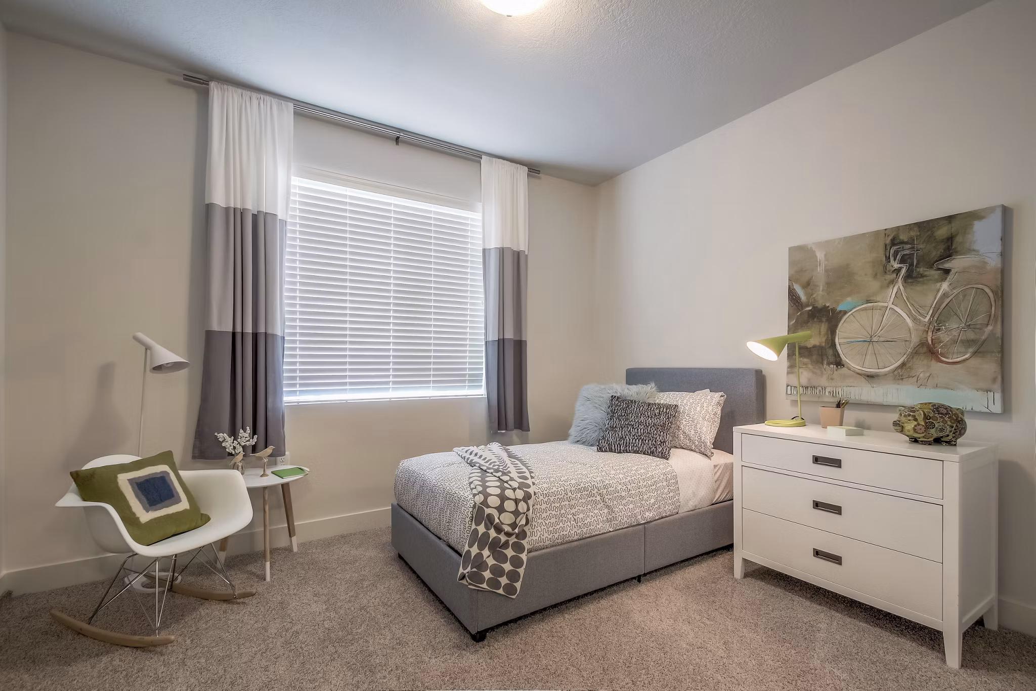 Spacious bedroom with large windows and modern decor at One West Apartments Perfect for luxury living and comfort seekers alike