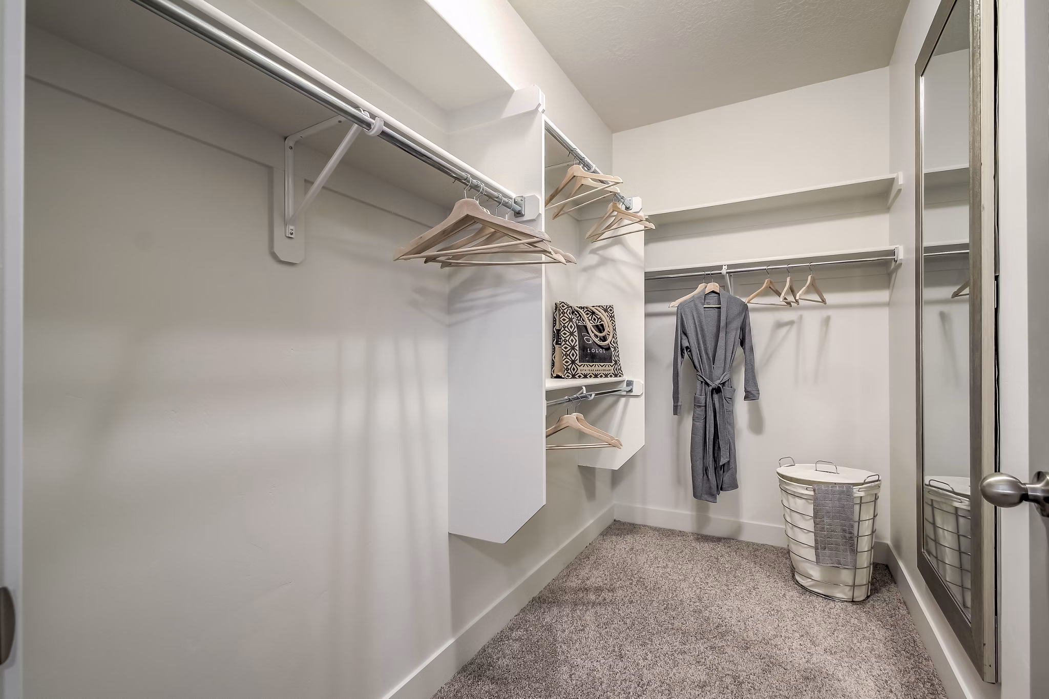 Cozy bedroom with modern decor and plush bedding at One West Apartments