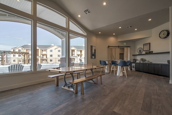 Game room with modern decor and pool table at One West Apartments
