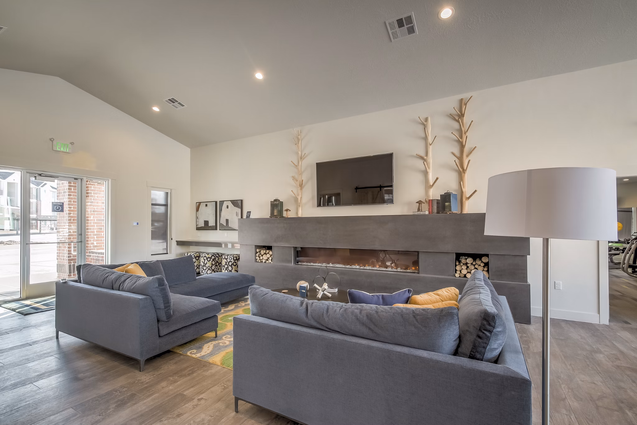 Elegant clubhouse featuring modern design and cozy seating at One West Apartments