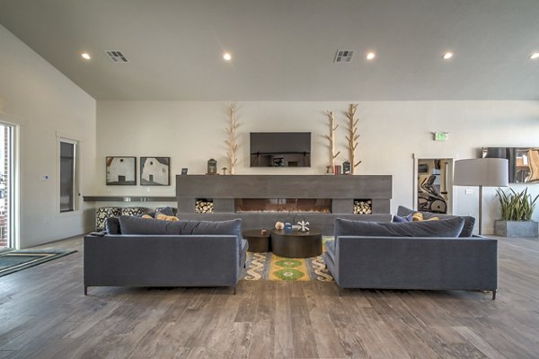 Upscale clubhouse featuring modern design and cozy seating areas at One West Apartments in West Haven, UT.