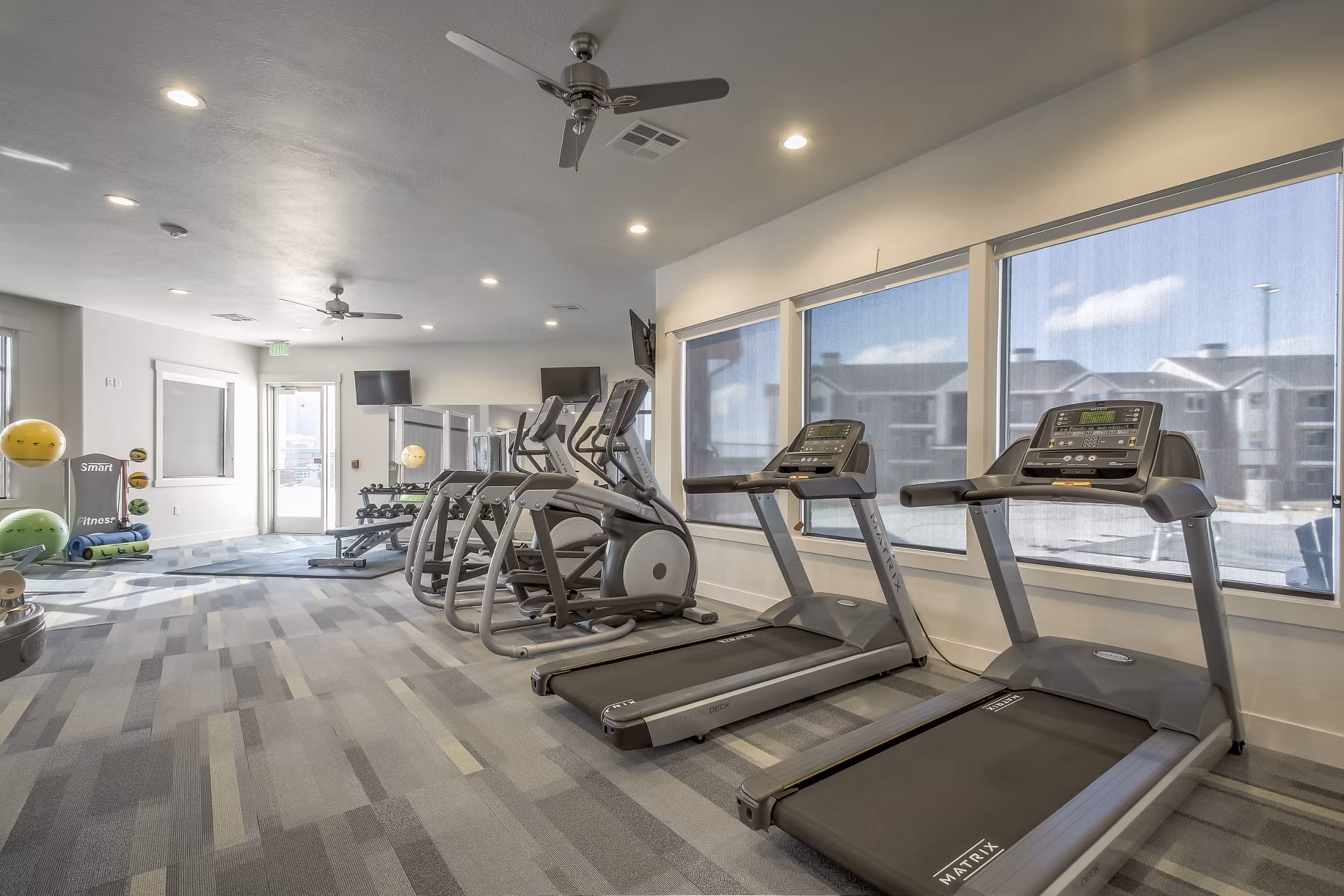 State-of-the-art fitness center at One West Apartments with modern equipment and spacious workout areas for residents