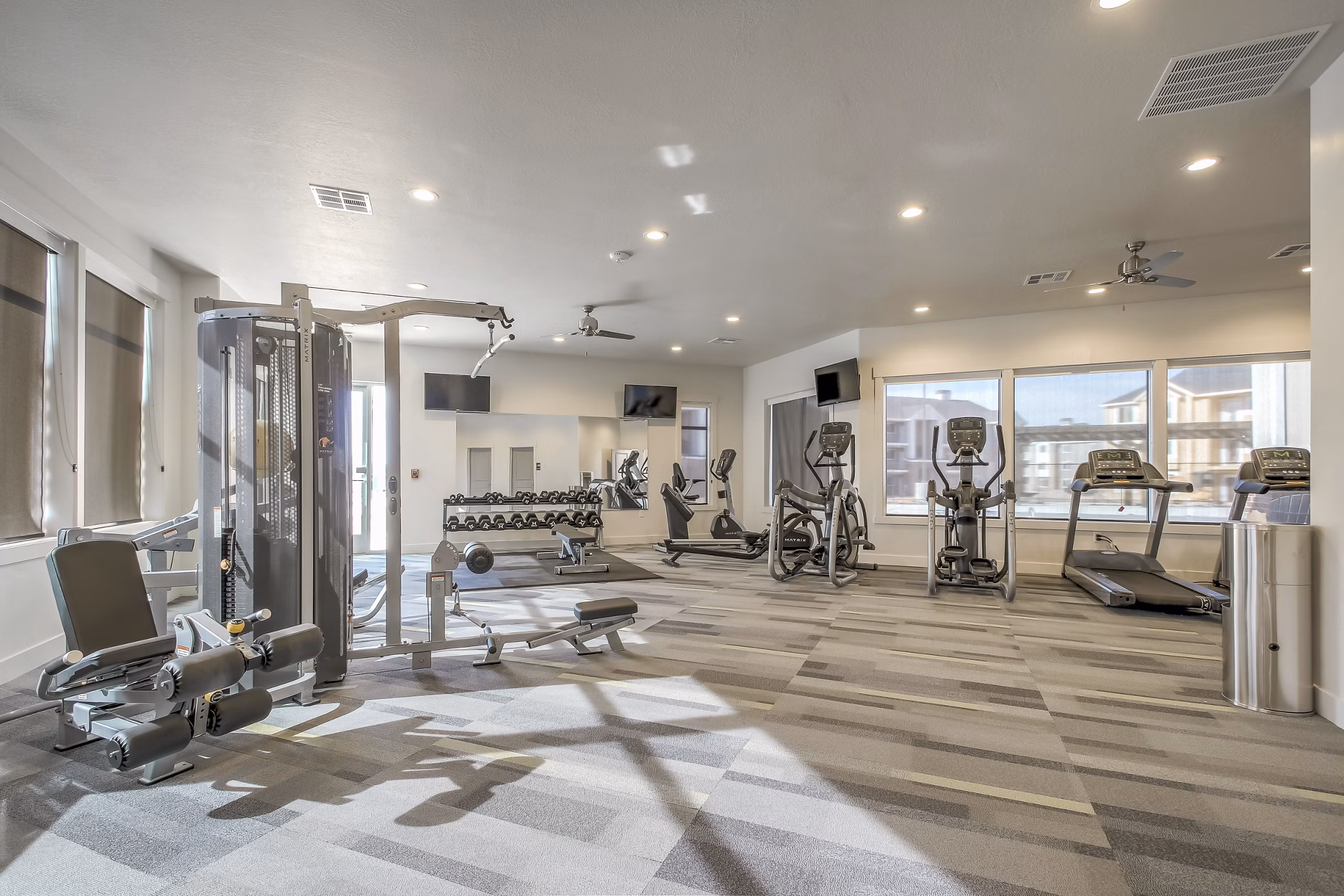 Modern fitness center with state-of-the-art equipment at One West Apartments