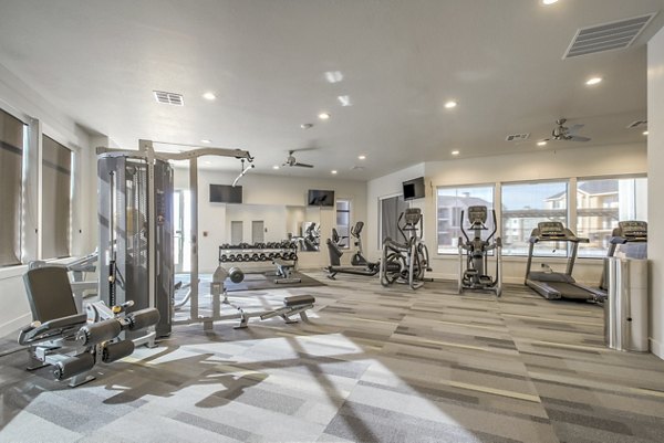 Modern fitness center with state-of-the-art equipment at One West Apartments