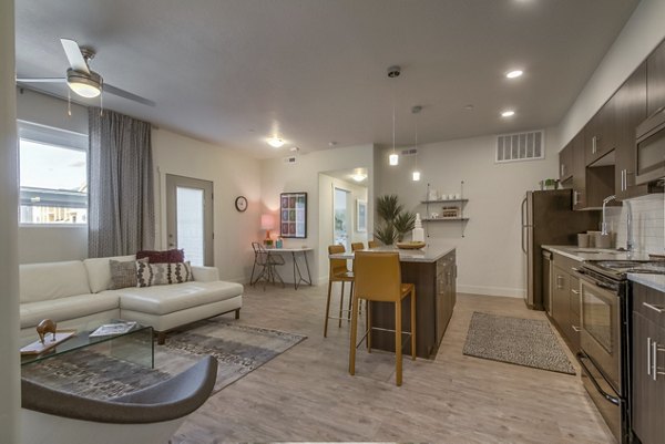 Modern kitchen with stainless steel appliances at One West Apartments
