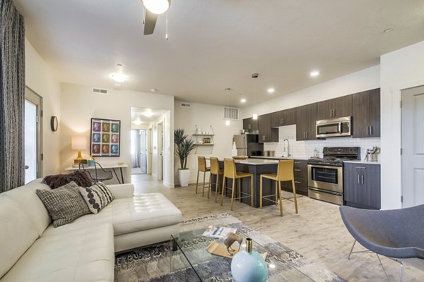 Stylish living room with contemporary furniture and natural light at One West Apartments, offering luxury living spaces in a vibrant community