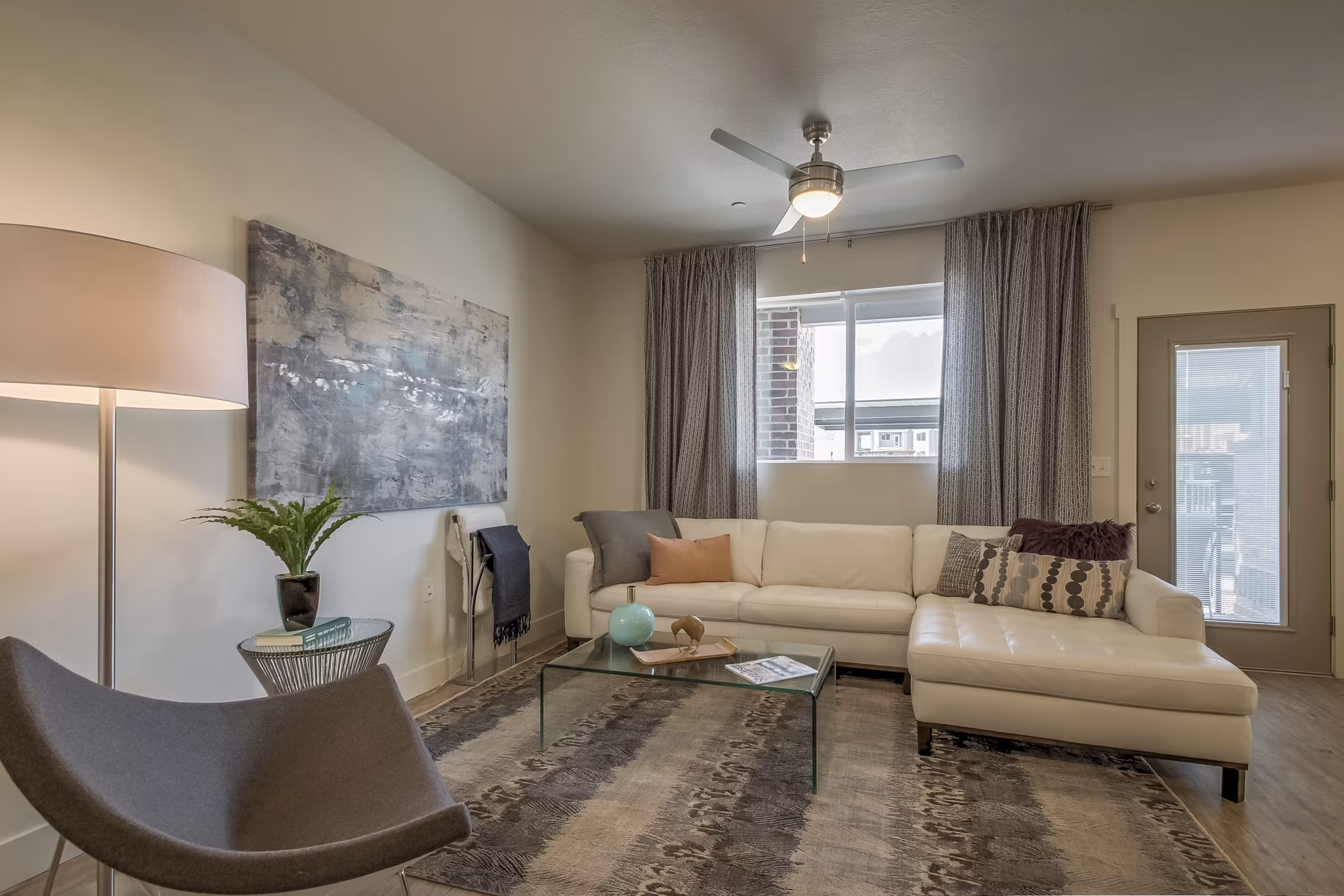 Spacious living room with modern decor at One West Apartments, luxury Greystar property