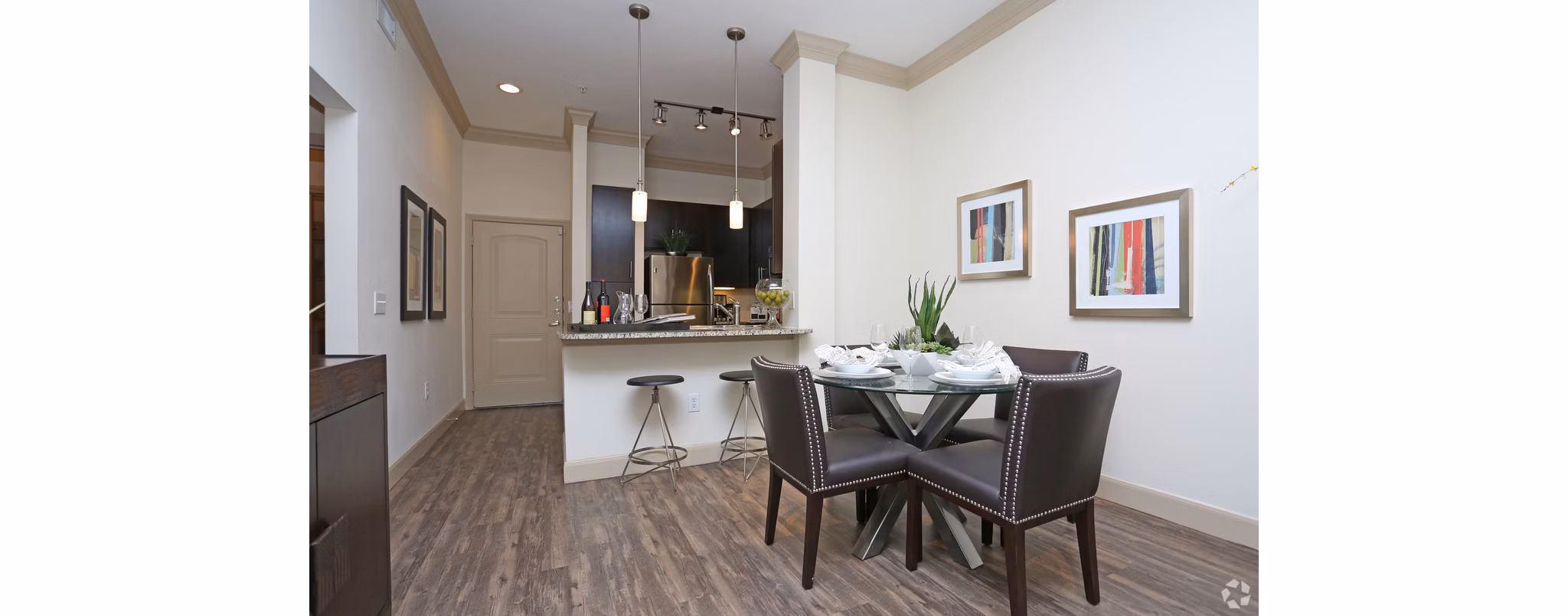 Dining area with sleek modern furnishings at Braeswood Place Apartments, showcasing luxury living