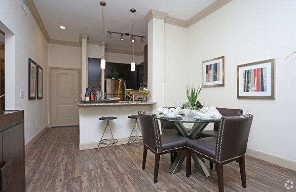 Dining area with sleek modern furnishings at Braeswood Place Apartments, showcasing luxury living