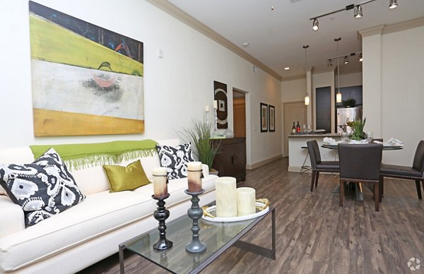 Bright living room with modern decor at Braeswood Place Apartments