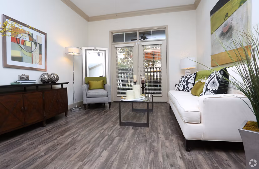 Spacious living room with modern furnishings in Braeswood Place luxury apartments