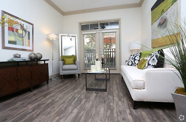 Spacious living room with modern furnishings in Braeswood Place luxury apartments