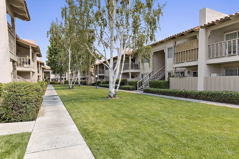Elegant lobby with marble floors and plush seating in The Franciscan Apartments, showcasing luxury living