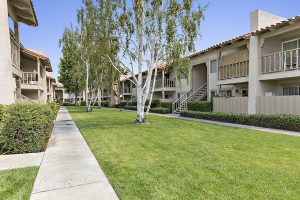 Elegant lobby with marble floors and plush seating in The Franciscan Apartments, showcasing luxury living