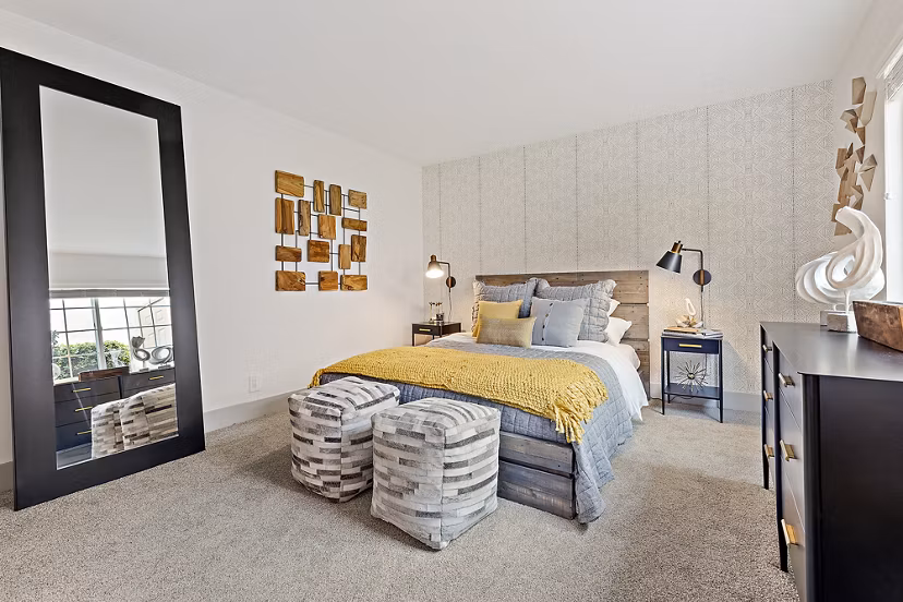 Cozy bedroom with plush bedding at The Franciscan Apartments, offering luxury accommodations for a restful night's sleep