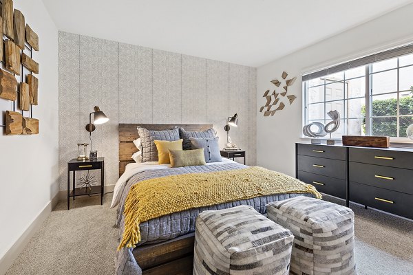 Cozy bedroom with soft lighting and modern decor at The Franciscan Apartments
