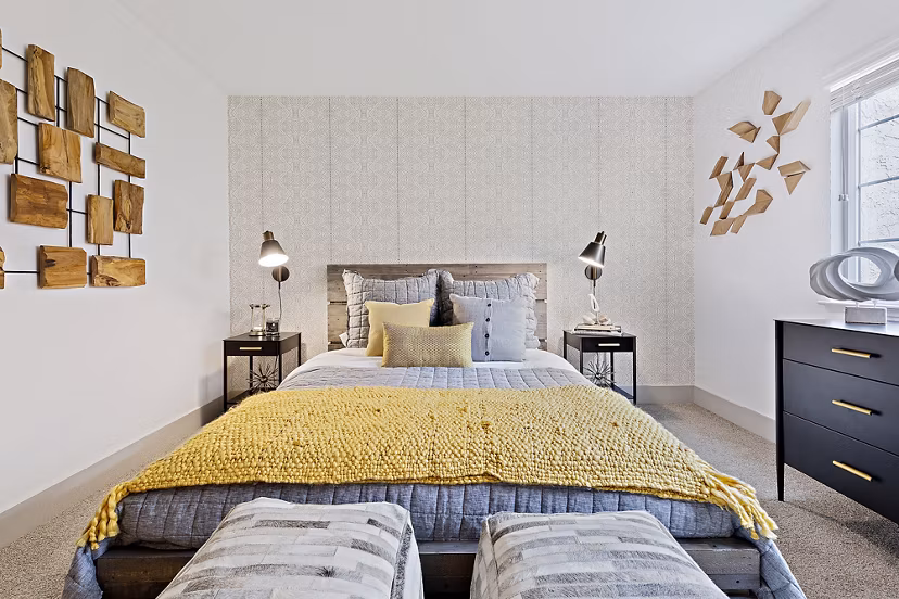 Spacious bedroom with modern furnishings at The Franciscan Apartments