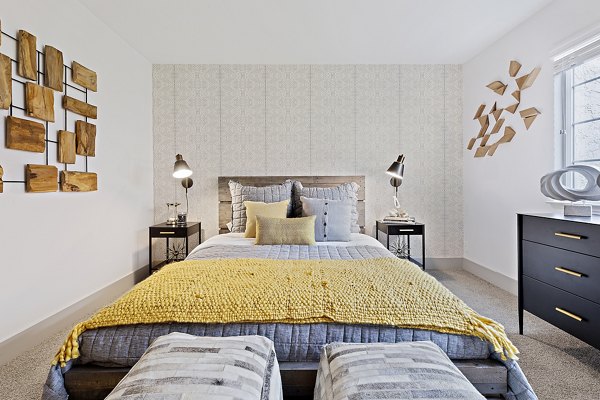 Spacious bedroom with modern furnishings at The Franciscan Apartments
