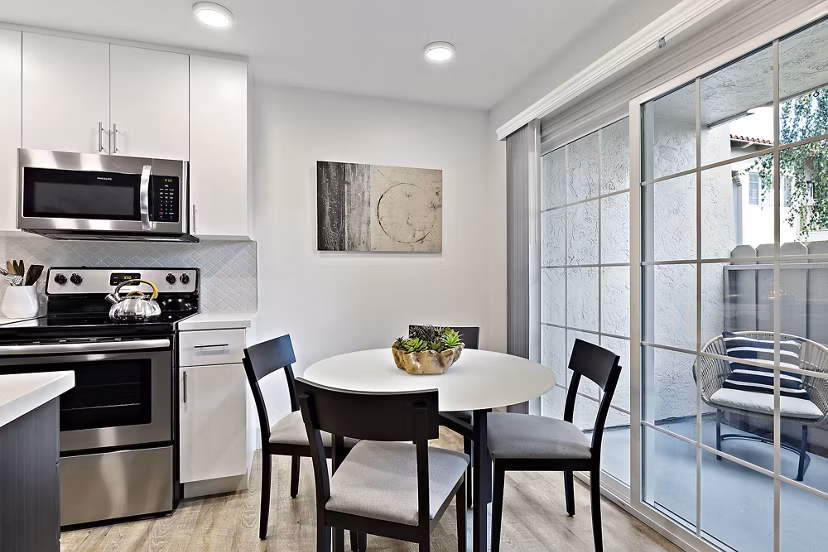 Spacious dining area with modern lighting in The Franciscan Apartments