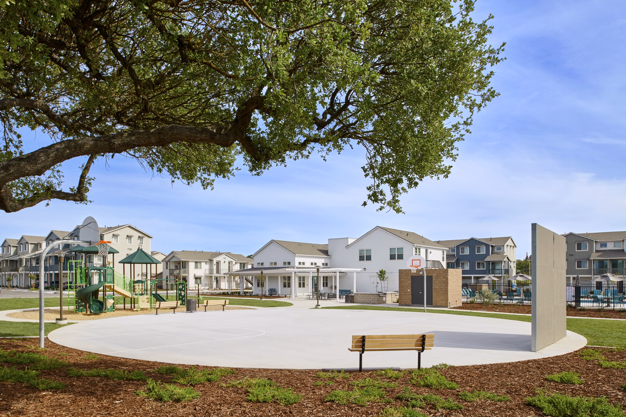 Playground with modern play structures at Blue Oak Apartments, offering a vibrant outdoor activity space for residents of Greystar luxury apartments