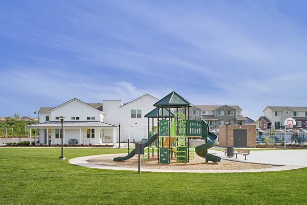Playground with modern play structures at Blue Oak Apartments