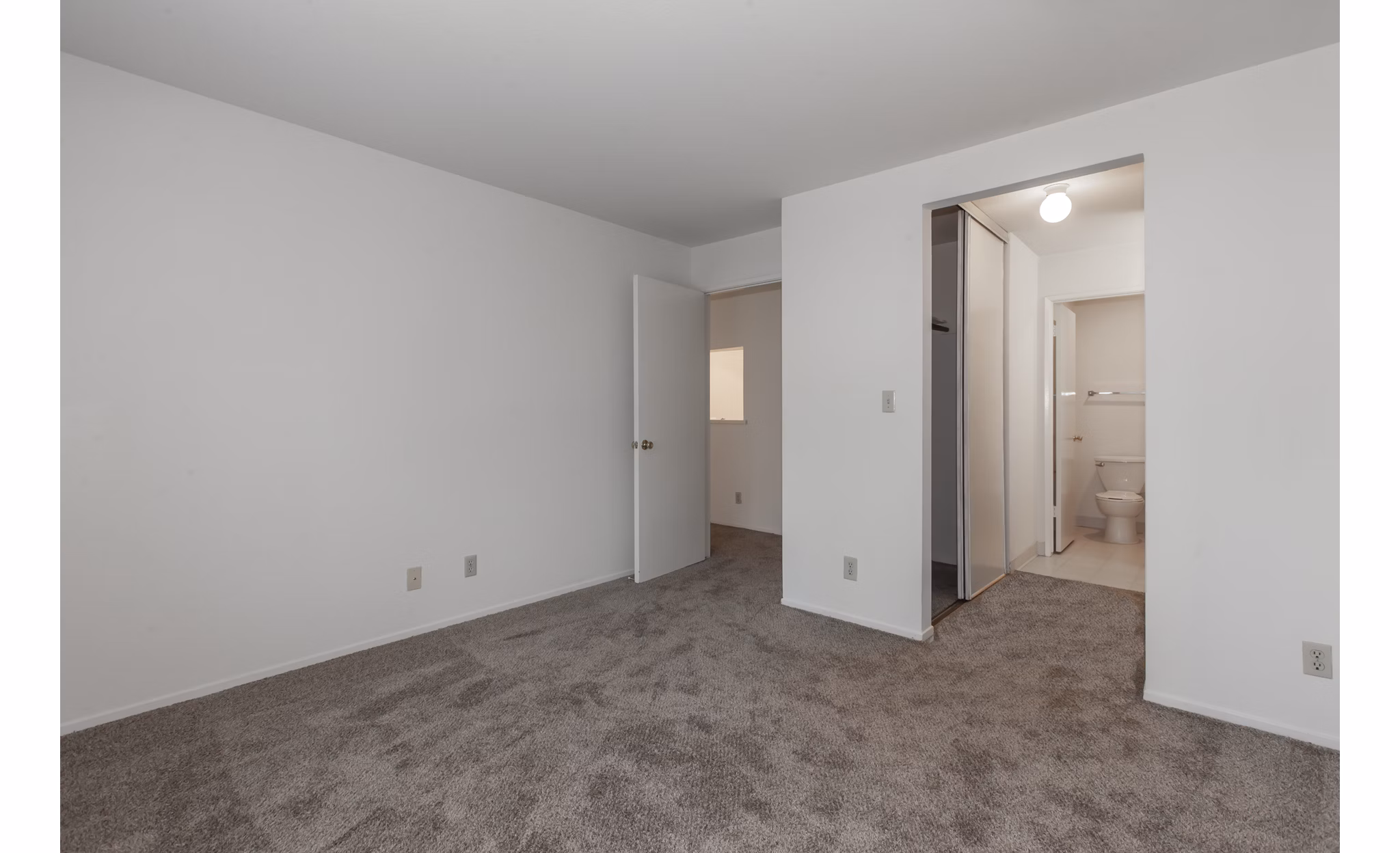 Cozy bedroom with modern furnishings at Monte Vista Apartments