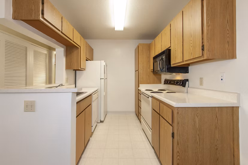 Modern kitchen with sleek cabinetry and stainless-steel appliances at Monte Vista Apartments