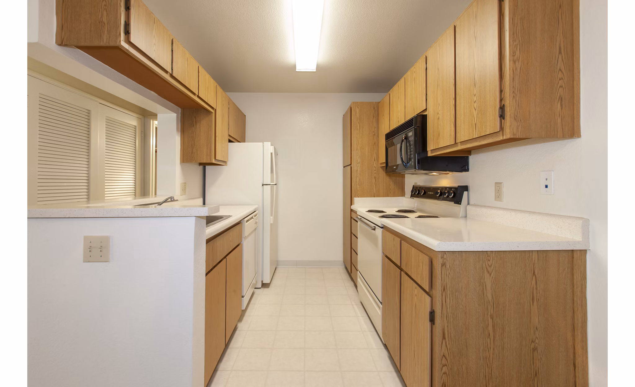 Modern kitchen with sleek cabinetry and stainless-steel appliances at Monte Vista Apartments