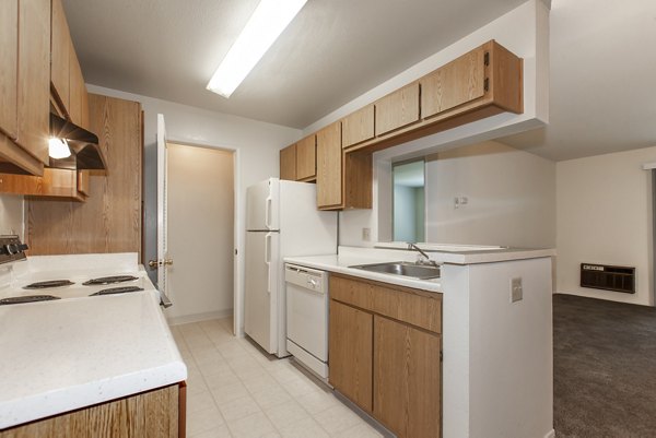 Monte Vista Apartments: Modern kitchen with stainless steel appliances and granite countertops