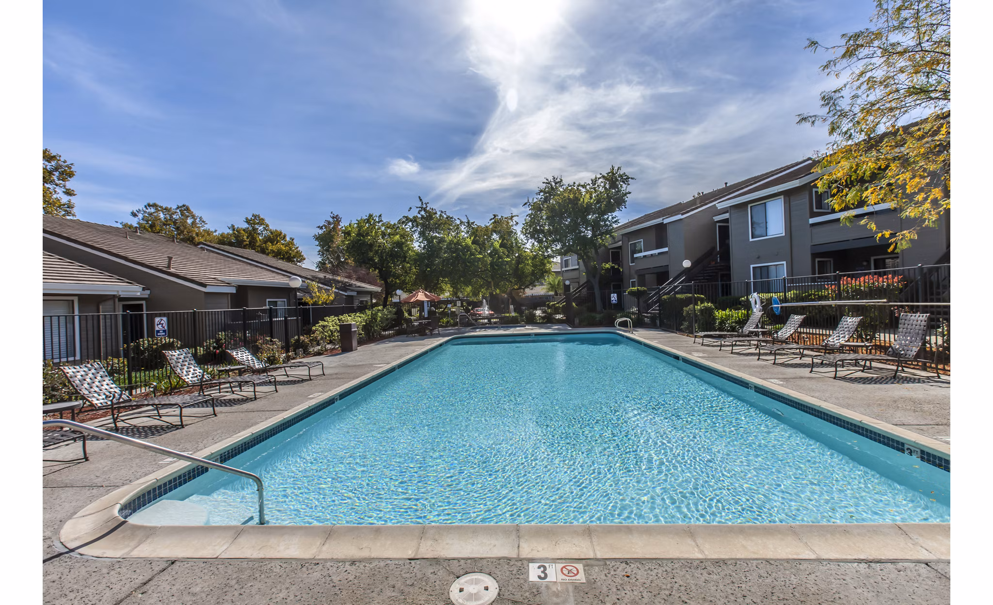 Sparkling outdoor pool at Monte Vista Apartments, ideal for relaxation and recreation in a scenic setting near Greystar luxury apartments