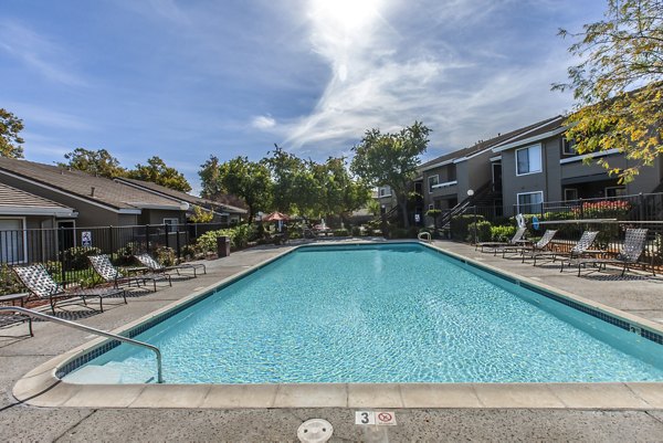 Sparkling outdoor pool at Monte Vista Apartments, ideal for relaxation and recreation in a scenic setting near Greystar luxury apartments