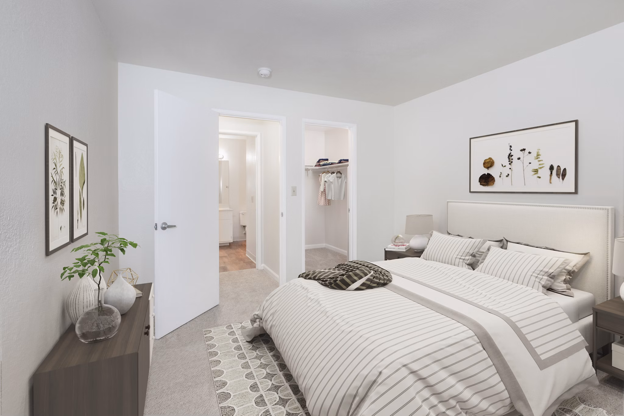 Cozy bedroom with modern decor in Brookside Apartments, featuring wood flooring and natural light