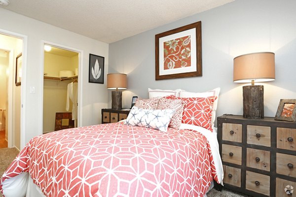 Luxurious bedroom with elegant decor at Brookside Apartments, featuring a cozy ambiance and stylish furnishings