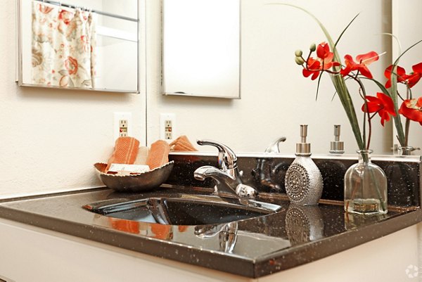 Brookside Apartments: Modern bathroom featuring sleek fixtures and spacious design