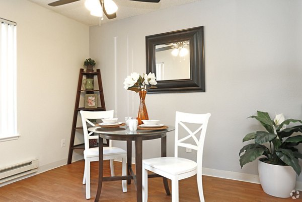 Dining area with modern furnishings and ambient lighting at Brookside Apartments