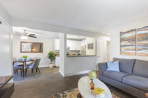 Spacious living room with modern decor in Brookside Apartments featuring luxury finishes and ample natural light