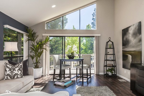 Living room featuring modern decor and cozy seating in Brookside Apartments, a luxury Greystar community