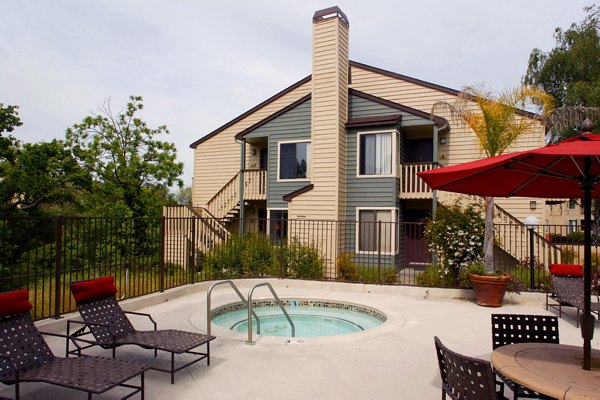 Inviting outdoor pool area at Brookside Apartments, perfect for relaxation and leisure in a serene setting