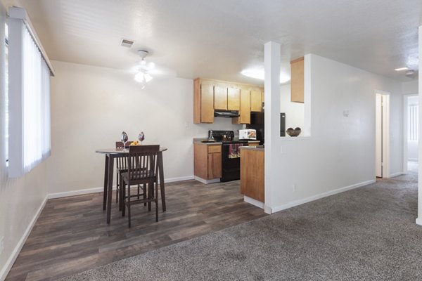 Dining room with elegant lighting and modern furniture at Mission Pines luxury apartments