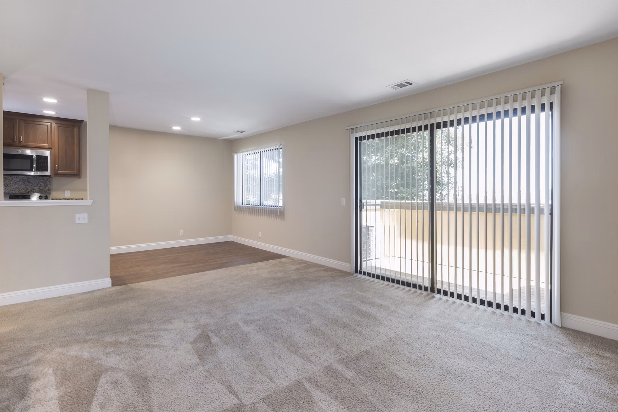 Living room with modern decor and large windows at Mission Pines luxury apartments