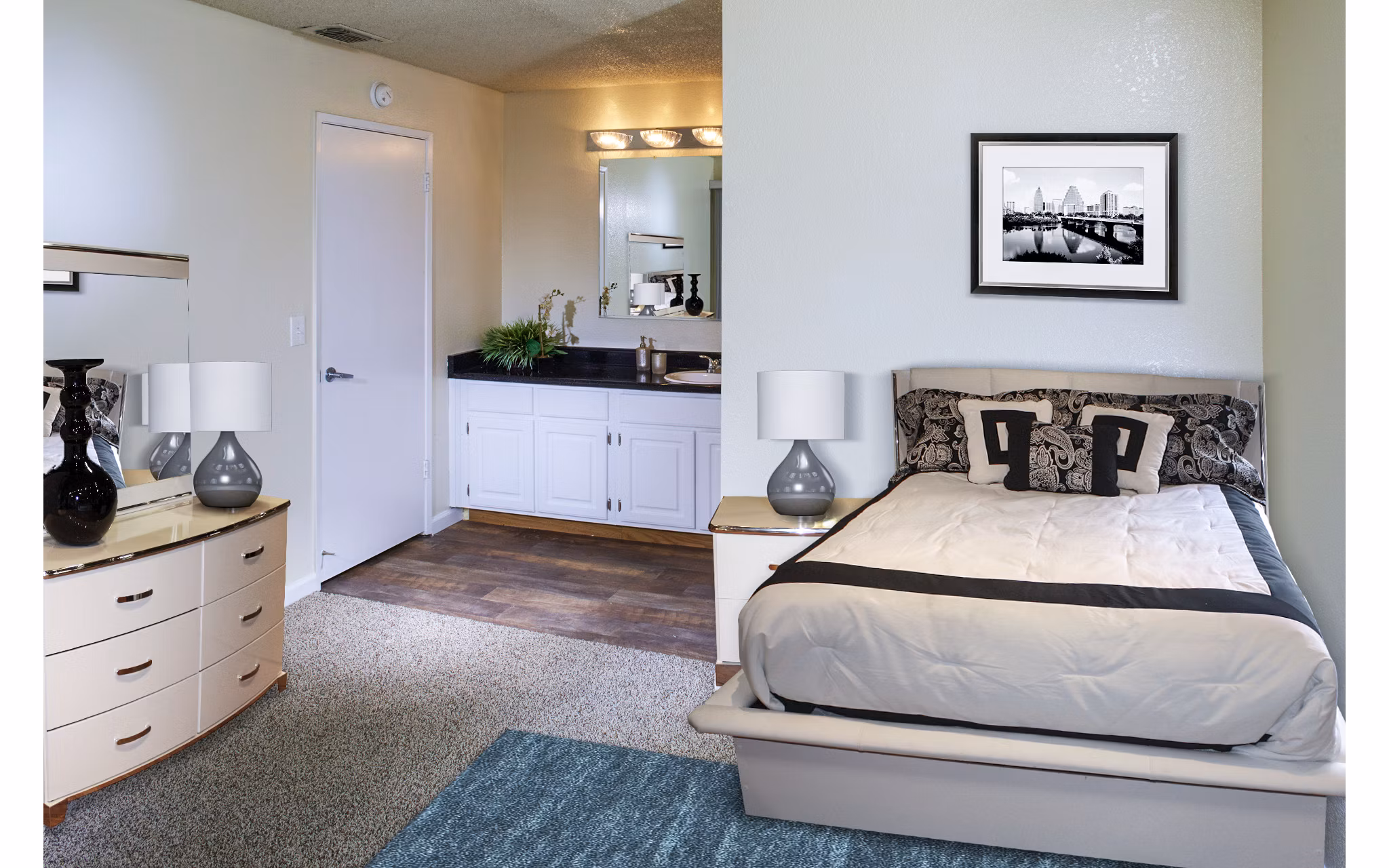 Cozy bedroom with modern decor at Vista Oaks Apartments featuring luxury bedding and soft lighting for a relaxing atmosphere